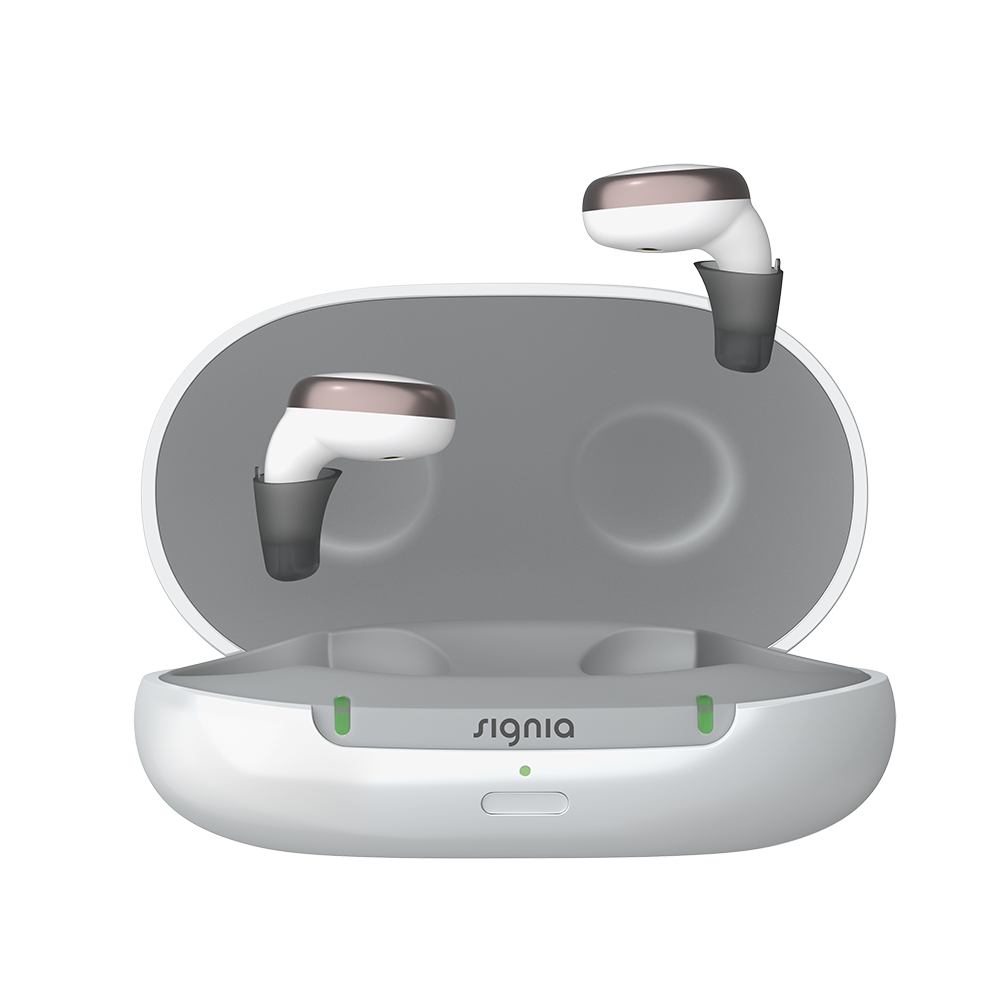 signia hearing aid accessories charger gold active pair in front of charger 10991346 